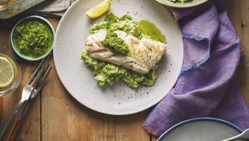 A plate of haddock with salsa verde,broccoli and bean mash