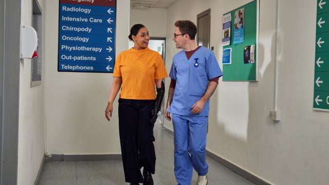 doctor and consultant walking and talking