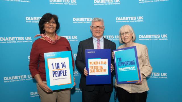 people holding banners about diabetes