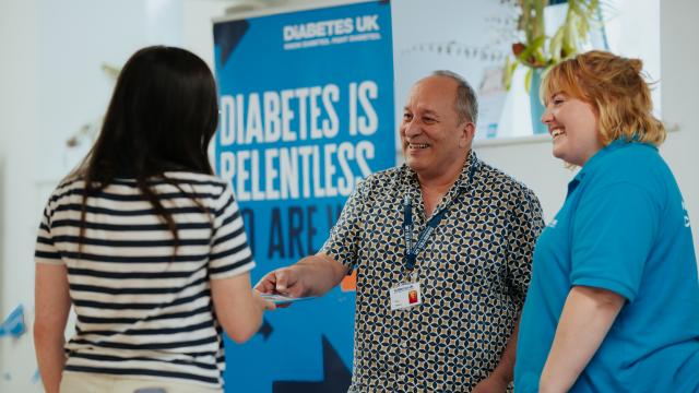 Diabetes UK staff greeting people at event
