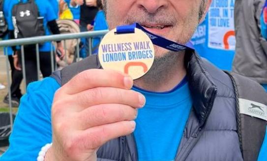 Kouros Majidi with his London Bridges Wellness Walk medal