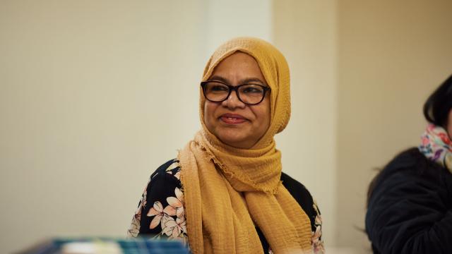 lady in yellow hijab smiling 