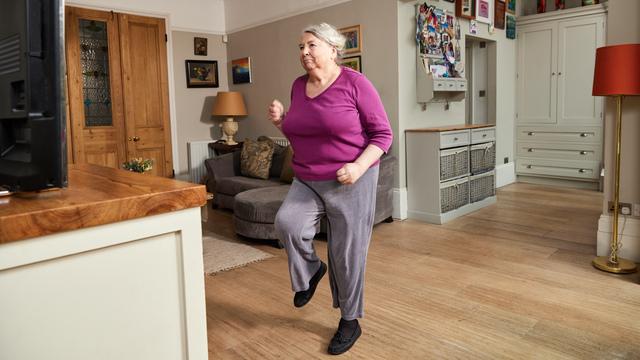A lady stepping on the spot as she takes part in the Diabetes UK Get Moving course