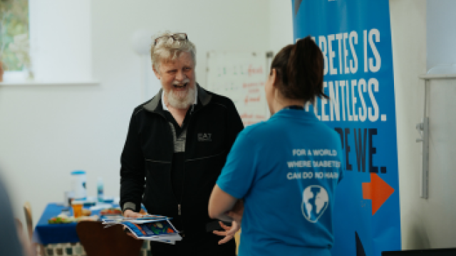 Man talking to Diabetes UK staff and getting support.